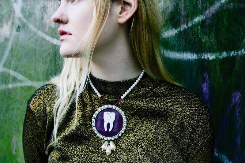 Female model photo shoot of MOSH Jewellery in London