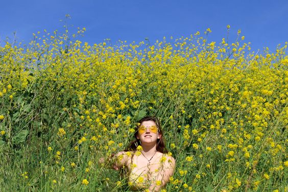 Female model photo shoot of Ciena Lennon in Flower field
