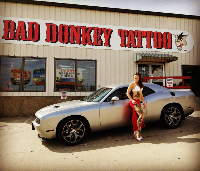 Female model photo shoot of Jay Nic Star in Bad Donkey Tattoo