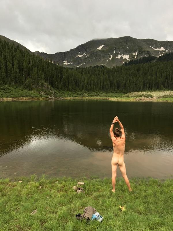 Male model photo shoot of Enchanted Sam in mountain lake