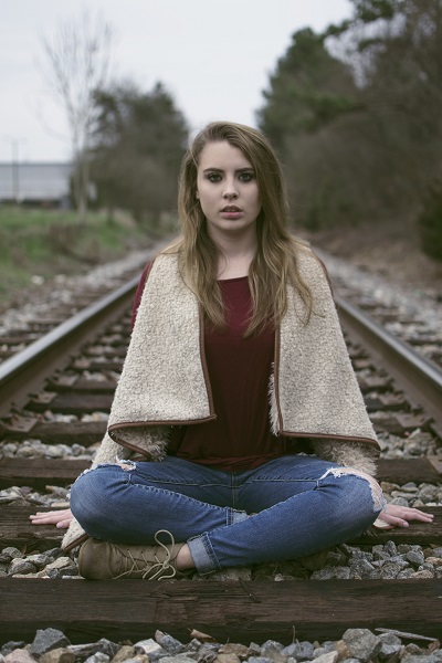 Female model photo shoot of MHWPhoto in Commerce Train Tracks