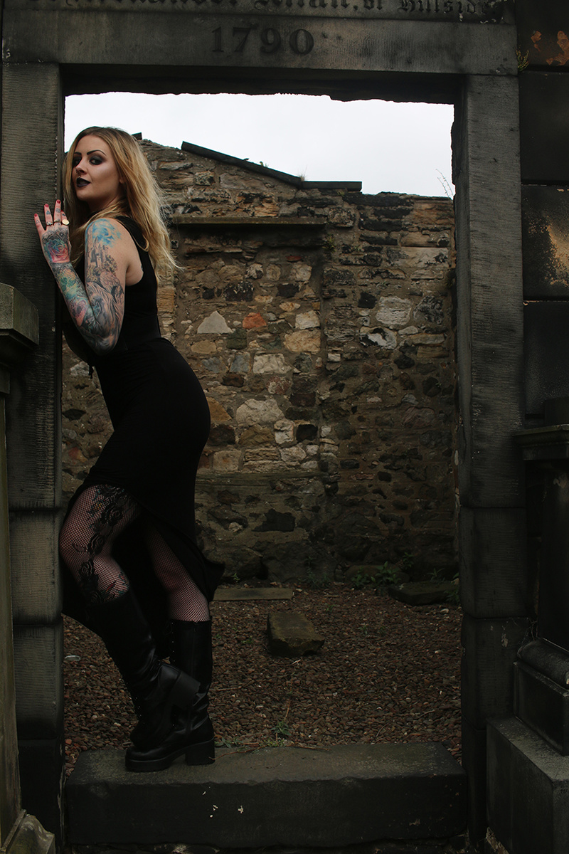 Female model photo shoot of Dark-light Photography in Old Calton Burial, Edinburgh