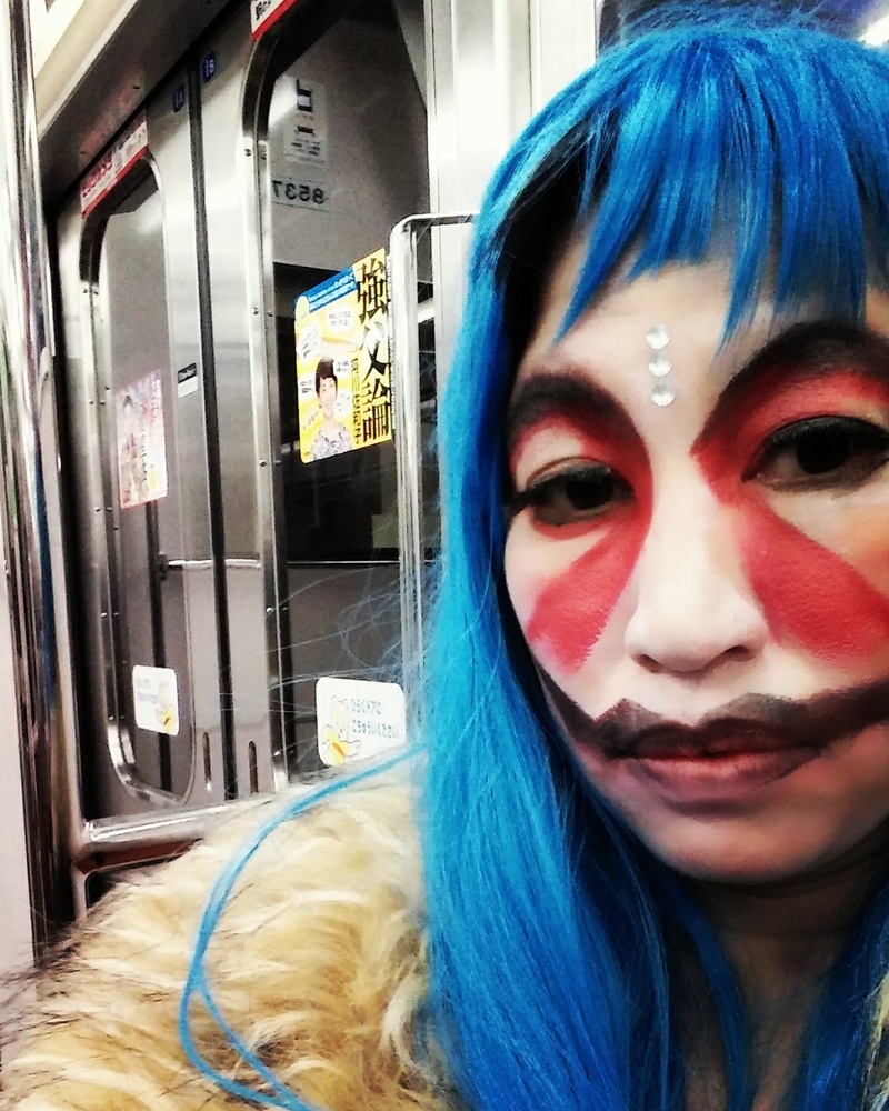 Female model photo shoot of Mariko Passion in shibuya train
