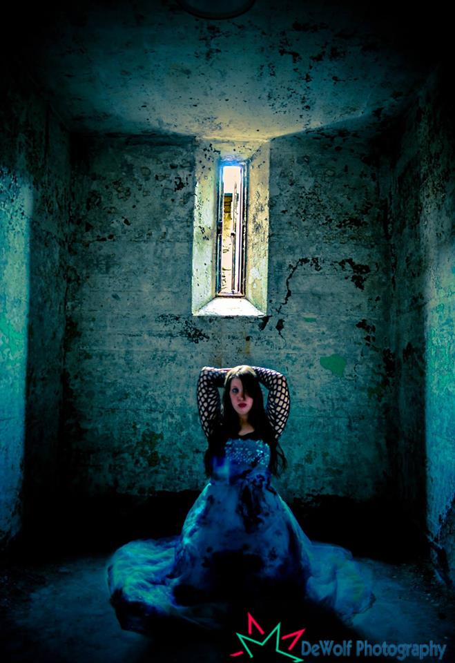 Female model photo shoot of Megami Conquista in Eastern State Penitentiary