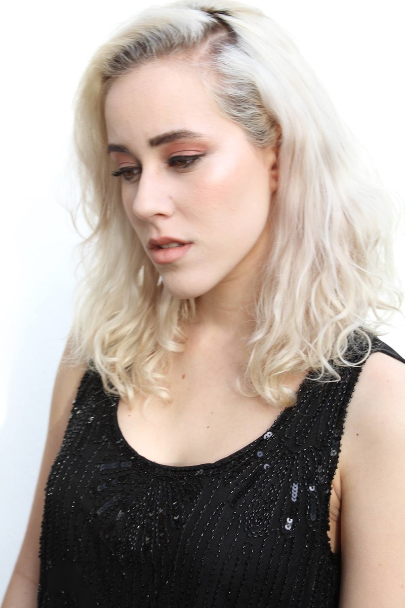Female model photo shoot of Emma Olliff in Brighton, clothing designed by Kate Dressekie