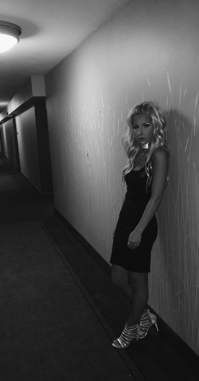 Female model photo shoot of kaithyatt in creepy hotel hallway.