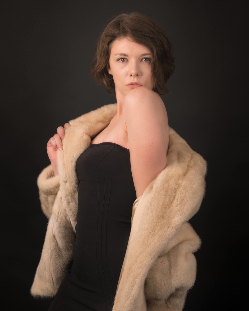 Female model photo shoot of Symoni Owens in Fashionable Fur