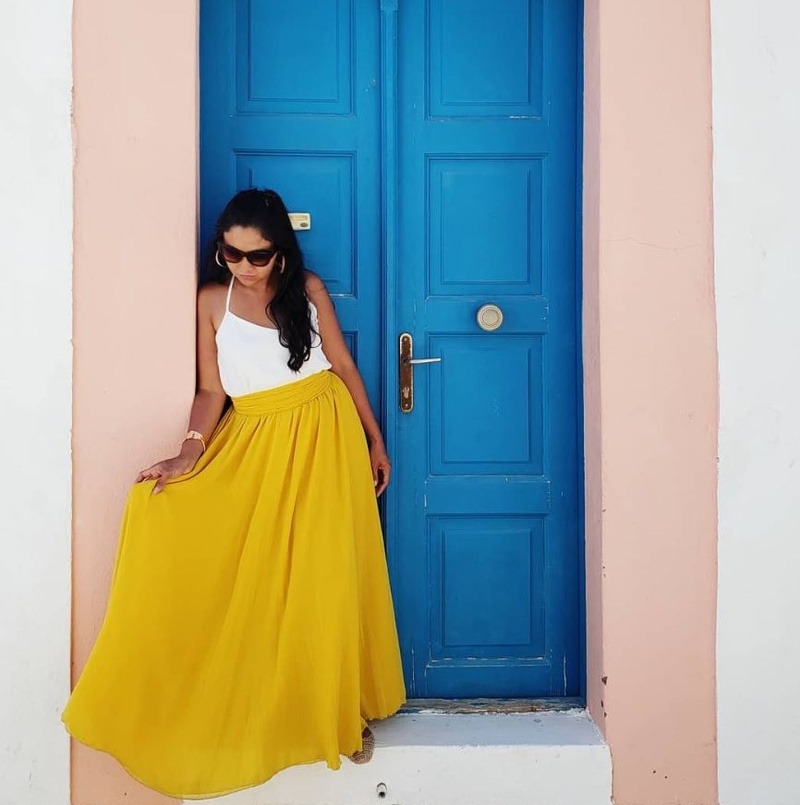 Female model photo shoot of nelrose in Oia, Santorini, Greece