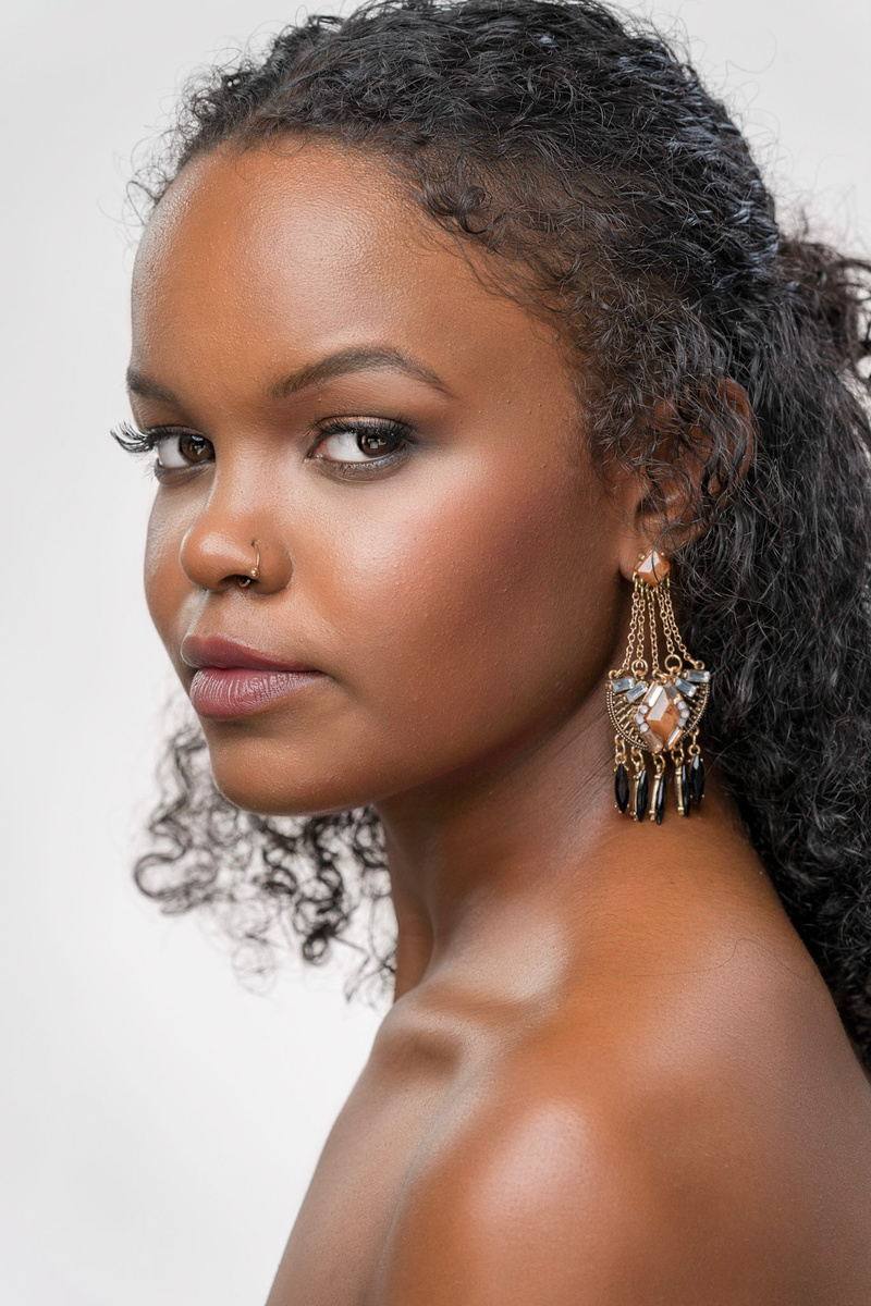 Female model photo shoot of De Lore by Dr_L33, makeup by ICBeauty Studio