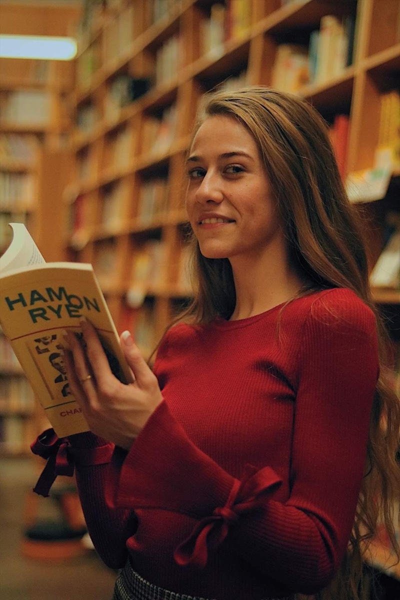 Female model photo shoot of megfaux in Powell's City of Books at Burnside