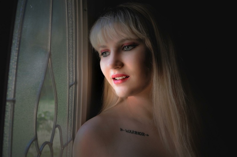 Female model photo shoot of Tattedblondebeauty