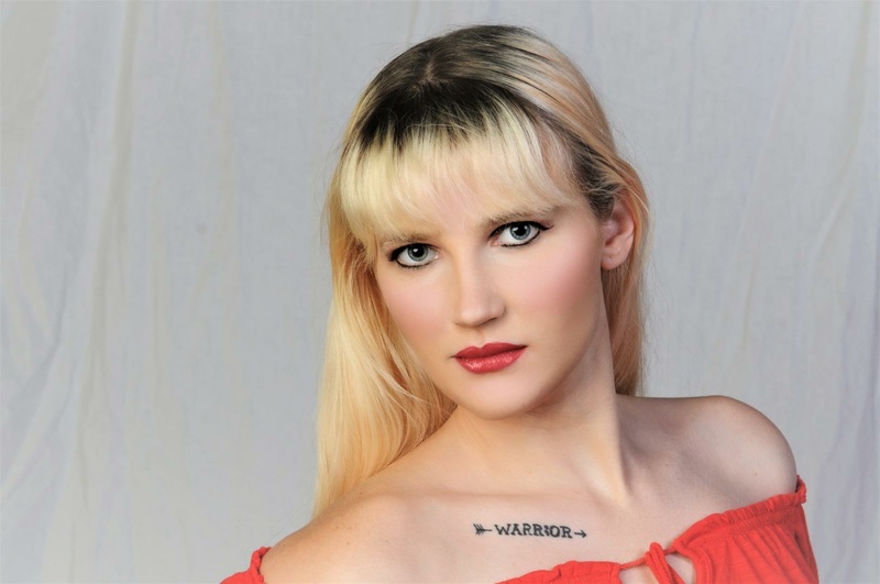 Female model photo shoot of Tattedblondebeauty