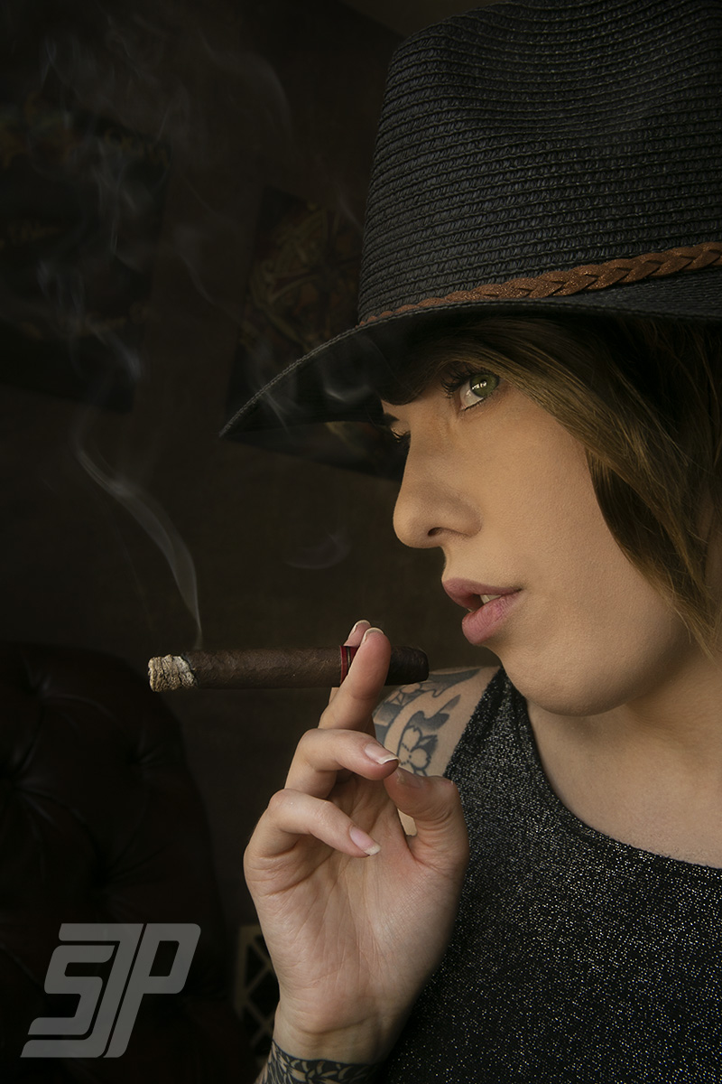 Male and Female model photo shoot of Square Jaw Photography and M_A_D_I in Beaufort Tobacco cigar lounge in Beaufort, SC