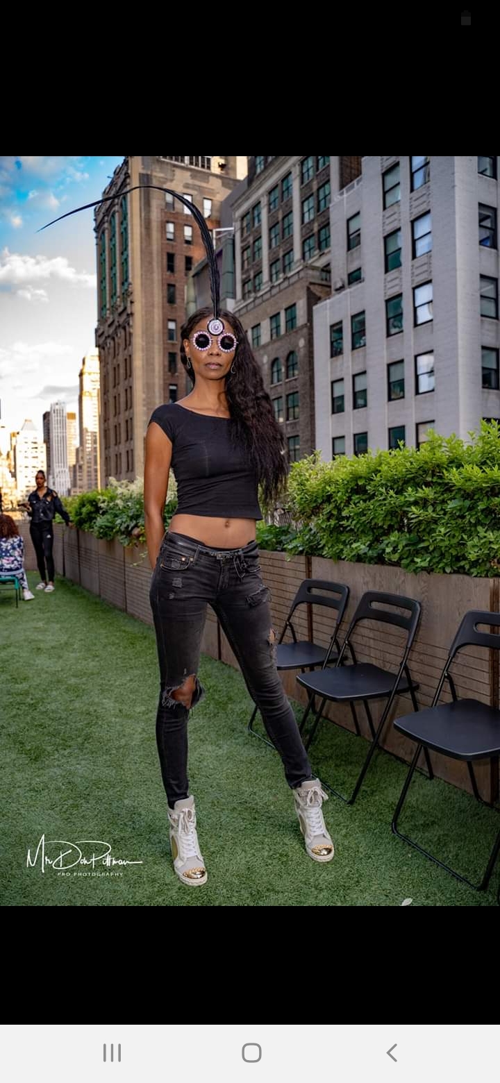 Female model photo shoot of Kontessia in 41 St. Broadway rooftop
