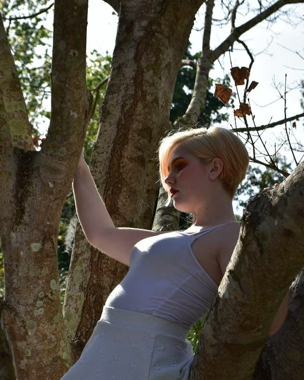 Female model photo shoot of EllaV in botanical gardens in largo florida
