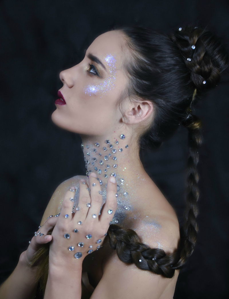Female model photo shoot of Glitter And Gold Images