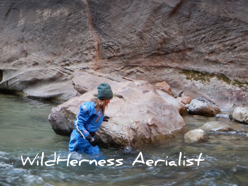 Female model photo shoot of WildHerness Aerialist in Virgin River Zion National Park