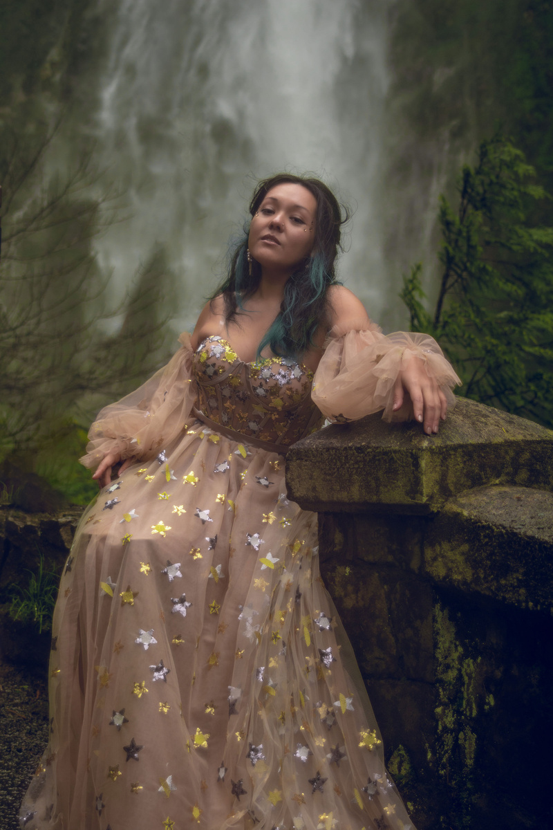 Female model photo shoot of Betsie Heart in Multnomah Falls, Oregon
