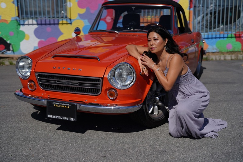 Female model photo shoot of Passion by Daniel Craig  in Datsun Roadster 1960's