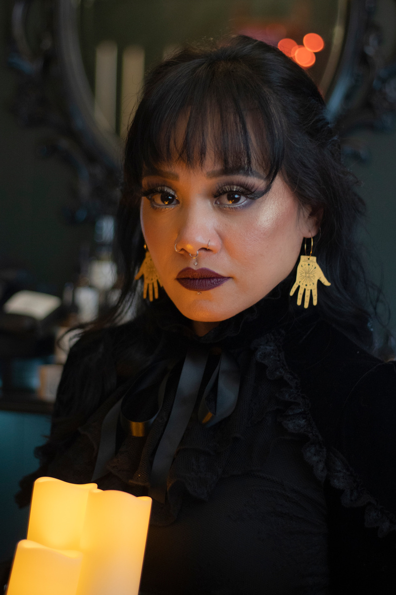Female model photo shoot of Le Chic Miami Earrings